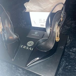 Versace calf leather pumps with golden hanging Medusa head safety pin. Worn once